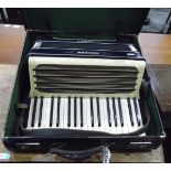 Carmen II accordion made by Hohner within its original leather case