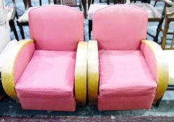 Pair of Art Deco armchairs with curving shew walnut arms and red upholstery and a matching two