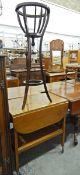 Edwardian jardiniere stand with slatted container on tripod base and an oak trolley with drop