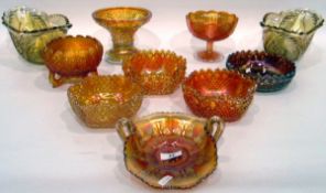 Large quantity of marigold carnival glass including a two-handled bowl of folded form decorated