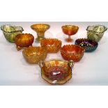 Large quantity of marigold carnival glass including a two-handled bowl of folded form decorated