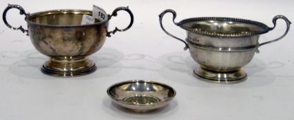 Silver two-handled sugar basin, circular with beaded border, with scroll handles, on beaded foot,