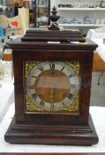 Regency-style mahogany bracket clock with urn finial,