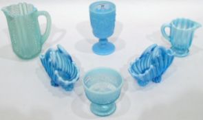 Quantity of blue pressed glass including a pair of baskets with opalescent rims, various jugs,