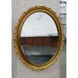 Modern oval framed mirror,