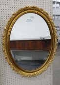 Modern oval framed mirror,