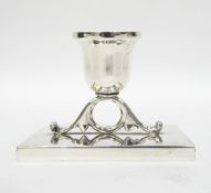 Single early 20th century candlestick mounted on a rectangular stand, marked 925 to base, 8cm high,