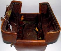 Late 19th/early 20th century doctor's leather bag with hinged top revealing a fitted interior,