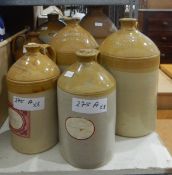 Eight stoneware flagons, one marked W M Tyrrell Wine & Spirit Merchant, Basingstoke,