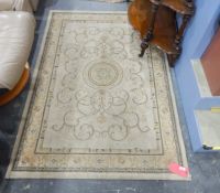 Modern Aubusson-style rug with circular medallion and scrollwork, on an ivory ground,