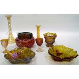 Quantity of carnival glass including three bowls decorated with leaves and berries,