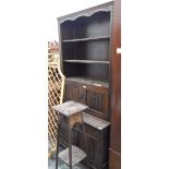 Oak bookcase fitted with three open shelves, with cupboards and drawers under,