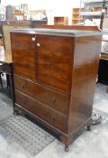 Mid 20th century walnut drinks cabinet fitted with a pair of figured cupboard doors over two short