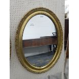 Modern oval gilt framed mirror,