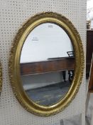 Modern oval gilt framed mirror,