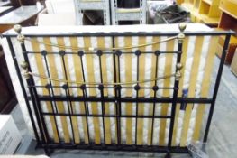 Modern brass and metal bedstead with mattress