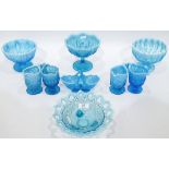 Large quantity of blue pressed glass with opalescent rims, including comports, pedestal bowls,