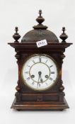 Oak cased mantel clock with three turned finials to the domed top, white enamel dial,