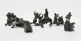 Three Japanese small bronze-effect metal model figure groups including groups of boys playing,