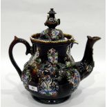 Victorian bargeware teapot of baluster form, moulded decoration and teapot finial to cover,