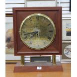 Mercer brass circular clock dial and movement mounted in modern mahogany case,