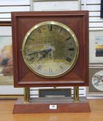 Mercer brass circular clock dial and movement mounted in modern mahogany case,