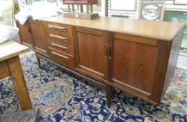 Mid 20th century G-Plan-style teak sideboard fitted with four central drawers flanked by cupboards,