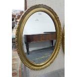 Modern oval gilt framed mirror,