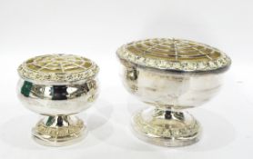 Pair of silver plated rose bowls of two sizes, decorated with a floral border, 10.