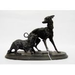 P J Mene style cast iron group of two dogs, a whippet and a spaniel, the oval base fan decorated,