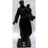 Large figure of monk holding child