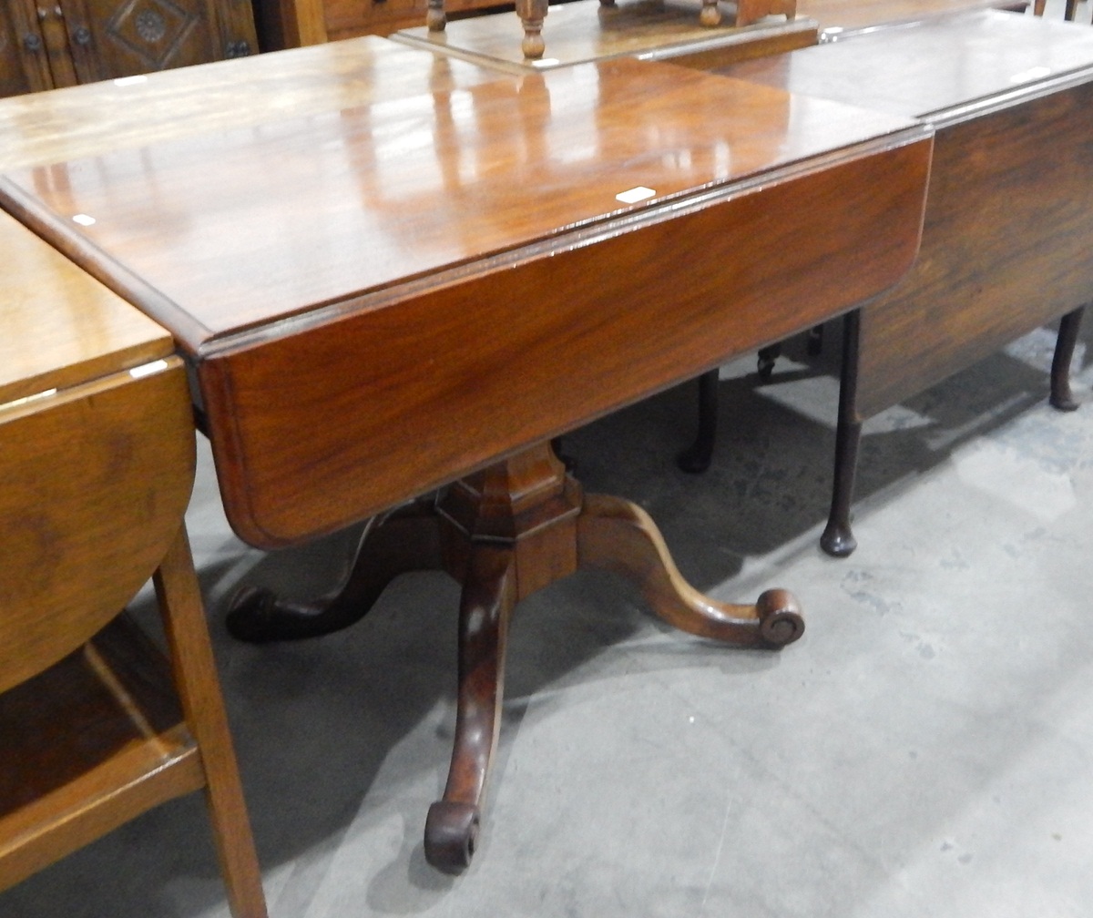Victorian mahogany pembroke table of rectangular form, on four scroll supports,