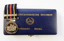 WWI Princess Mary Christmas tin with eleven miniature medals together with Gloucestershire