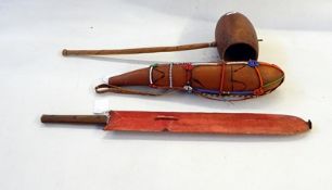 Tribal weapons to include three spears, edged weapon, machete in sheath, seed pod,