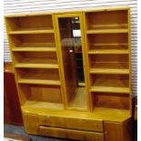 German Hülsta living room unit with central glazed door flanked by open shelves with cupboards