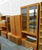 Suite of German Hülsta furniture comprising a glazed two-door cupboard, a display cabinet, shelves,