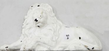 A pair of cast iron recumbent lion panels,