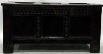17th century oak coffer, the three-panelled top above a fluted frieze,