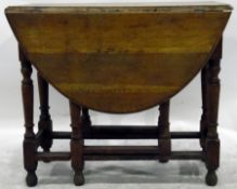 Light oak oval-top gateleg table with moulded edge top, on turned legs united by stretchers,