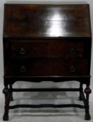Queen Anne style walnut veneer bureau, the interior fitted with small drawers and pigeonholes,