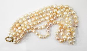 Three-strand champagne and cream baroque pearl necklace with gold coloured metal clasp, approx.