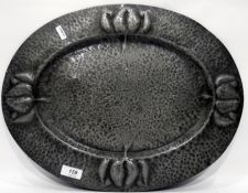 Art Nouveau hammered pewter oval tray, the flattened everted rim with stylised floral decoration,