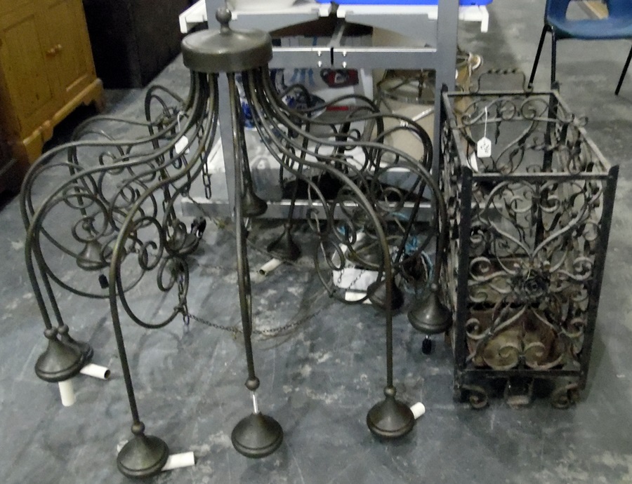 Large wrought iron hanging lamp divided into 12 separate sconces, adapted for electricity,