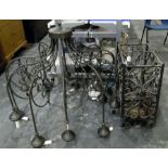 Large wrought iron hanging lamp divided into 12 separate sconces, adapted for electricity,