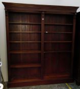 Mahogany bookcase fitted with two sets of adjustable shelves,