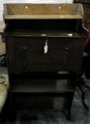 Late 19th century stained oak writing desk, the fall front with metal flowerhead strap hinges,