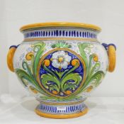 Continental faience-style two-handled jardiniere, bulbous and shouldered with ring handles,