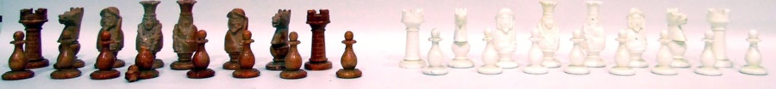 Set of carved hardstone chess pieces within a basket