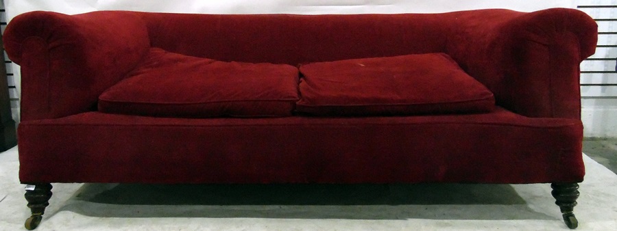 Chesterfield sofa upholstered in red fabric,