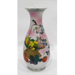 20th century Chinese vase, baluster-shaped and floral and fruit decorated, on a pink ground, 30.